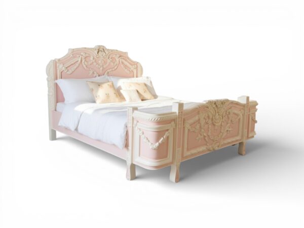 Ornate French-style bed with floral carvings and ivory accents