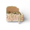 Ornate French-style bed with floral carvings and ivory accents