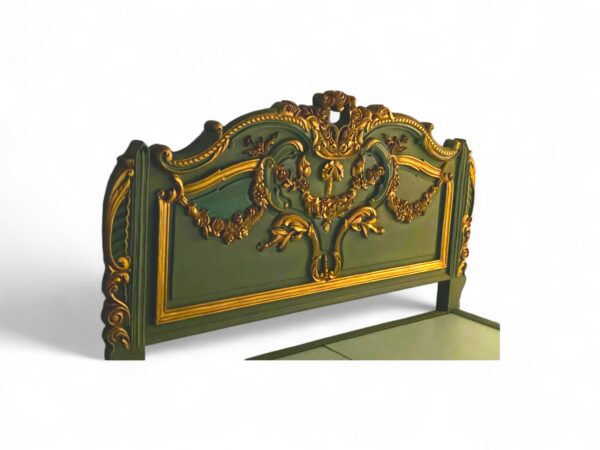 Hand-carved emerald bed with Baroque floral and ribbon detailing