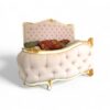 Italian baroque-style blush velvet bed with tufted design.