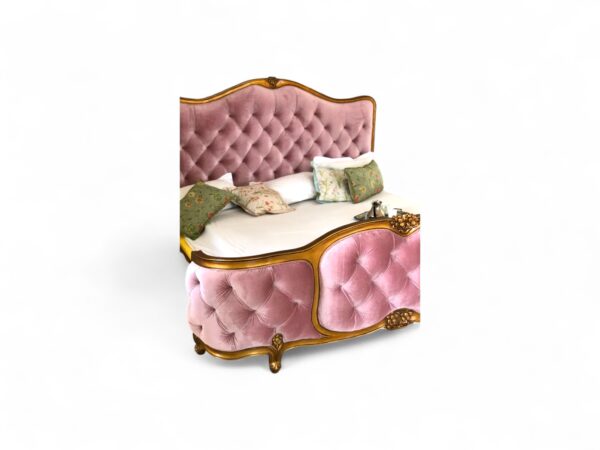 Luxury velvet bed with classic French silhouette and gold accents