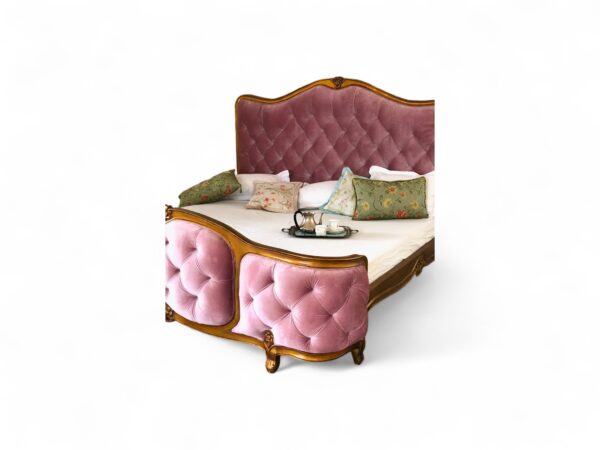 Elegant vintage-style bed featuring rose velvet and floral carvings