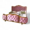 French romantic bed with tufted pink velvet and curved gold wood