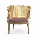 Antique Roselle Chair with carved wooden frame and cane backrest
