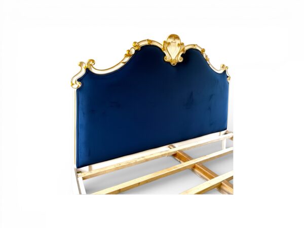 Designer upholstered bed with carved frame