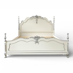Timeless vintage French bed with ornate scrollwork design