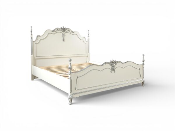 Romantic white French bed with classic carved details and soft finish