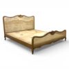 French country-style cane bed with organic woven texture