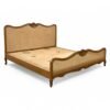 French country-style cane bed with organic woven texture