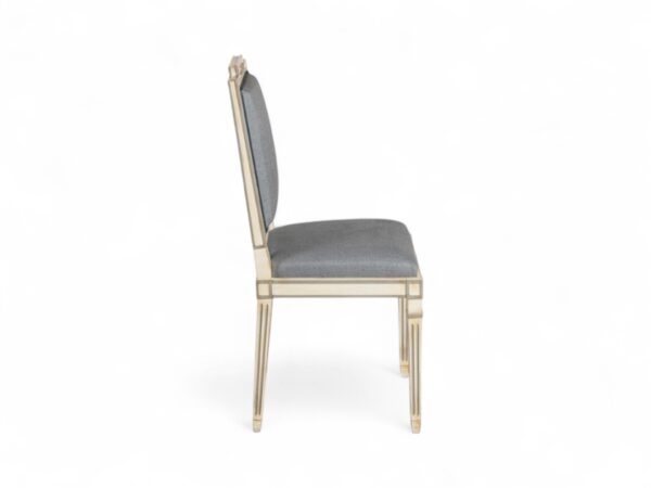 Traditional European-style chair with detailed frame and plush seat