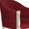 Classic velvet barrel armchair with curved back and elegant accents
