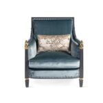 Elegant velvet armchair with black lacquered frame and golden detailing