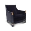 Statement teal velvet armchair with gold accents and wooden frame