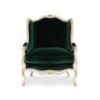 Luxurious emerald green armchair with hand-carved gold accents