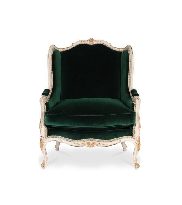 Luxurious emerald green armchair with hand-carved gold accents