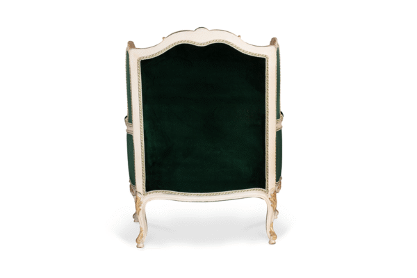 Classic velvet armchair with ornate gold leaf frame