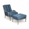 Blue velvet lounge chair with ottoman and carved wood frame