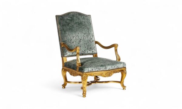 Ornate green velvet armchair with carved gold frame