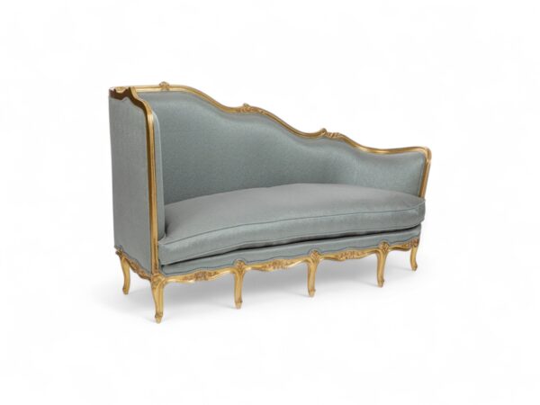 Side view of French Chaise Lounge showing detailed carved gold frame