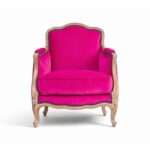 Luxurious velvet armchair with intricate wood carving