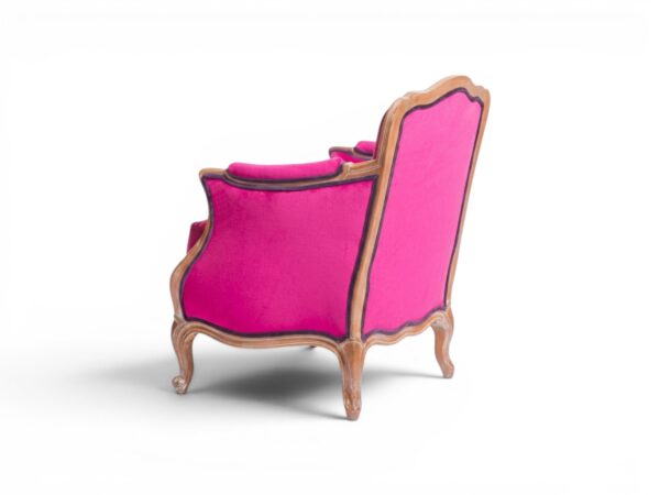 Bold fuchsia velvet accent chair with refined details