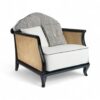 Modern velvet chair with caned sides and sleek black frame
