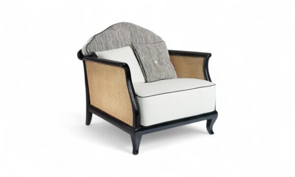 Modern velvet chair with caned sides and sleek black frame