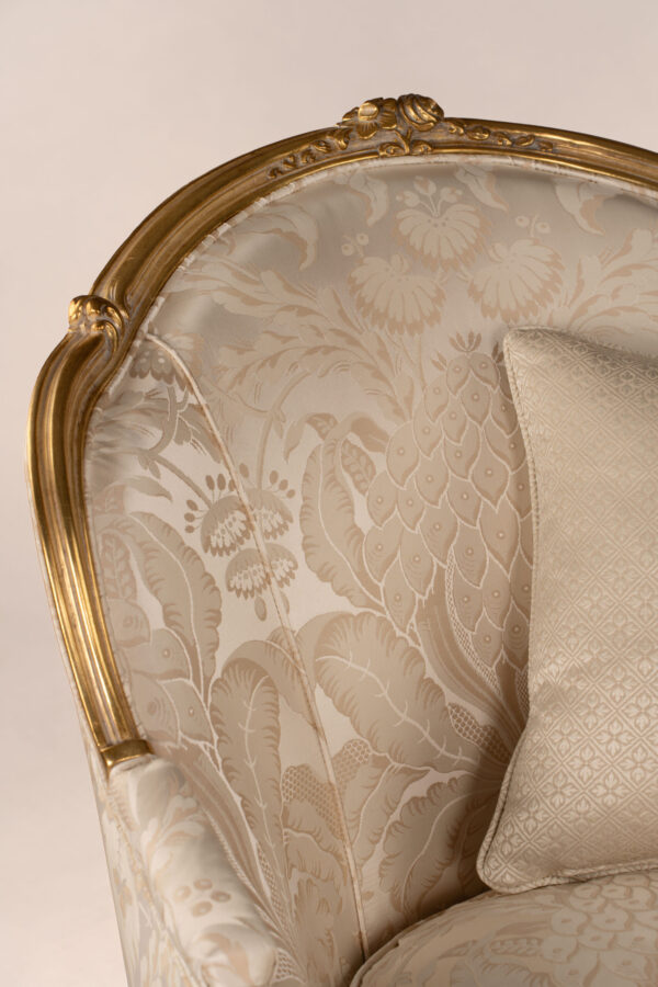 Gold Louis Armchair with plush seat and intricate frame design
