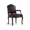 Ebony Splendor Armchair with intricate carvings and red upholstery