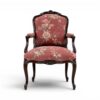 Ebony Splendour Armchair with intricate carvings and floral upholstery