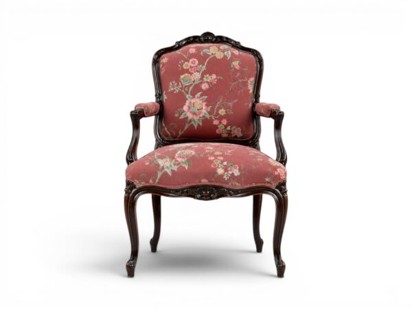 Ebony Splendour Armchair with intricate carvings and floral upholstery