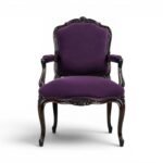 Ebony Splendour Armchair with intricate carvings and red upholstery