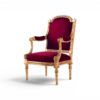 Gilded velvet armchair styled in classic interior setting