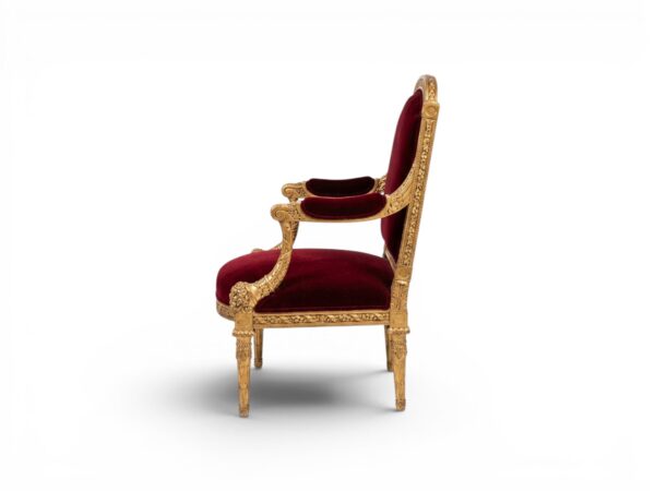 Crimson velvet armchair with carved neoclassical golden frame