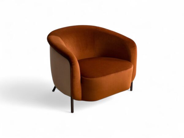 Designer armchair with slim tapered legs in amber finish