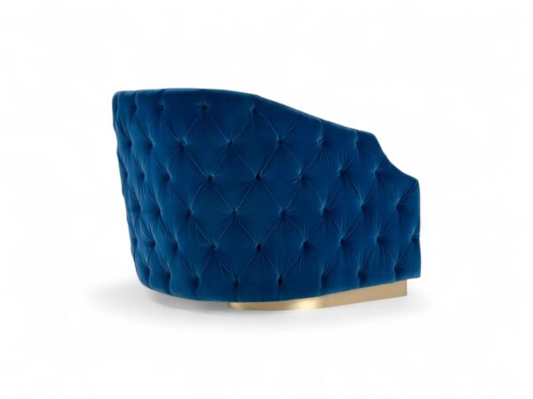 Modern velvet chair with elegant tufting and gold metal details