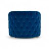 Luxurious blue velvet armchair with tufted backrest and gold legs