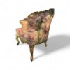 Handcrafted vintage wooden armchair with carved frame