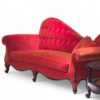 Luxurious red velvet chaise lounge with rolled arms