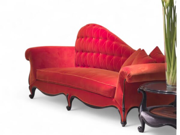 Luxurious red velvet chaise lounge with rolled arms