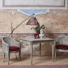 Elegant caned accent chair in solid teak wood