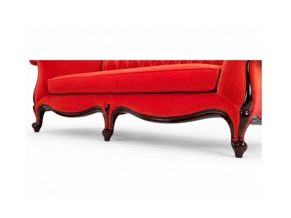 Luxurious red velvet chaise lounge with rolled arms