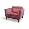 Elegant blush velvet armchair with plush cushioning and minimal design