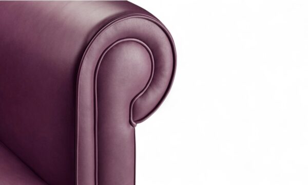 Contemporary armchair with rounded arms and soft purple leather