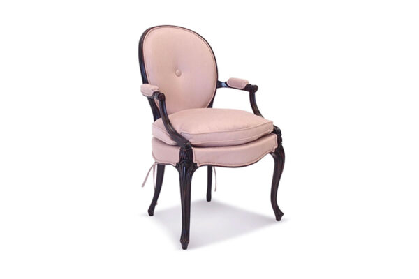 Designer armchair with luxurious velvet and vintage wood craftsmanship