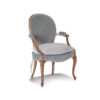 Bold velvet armchair in fuchsia and orange, perfect for stylish interiors.