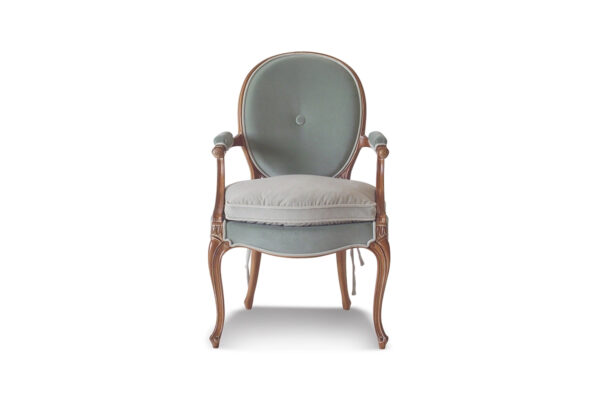 Luxury armchair with intricate wood details and plush cushioning