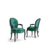 Elegant fuchsia velvet armchair with carved wooden frame