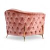 Luxury pink velvet chair with flared arms and high backrest
