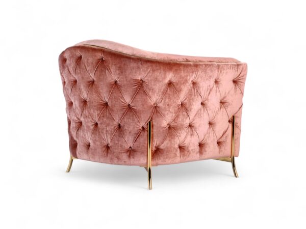 Luxury pink velvet chair with flared arms and high backrest